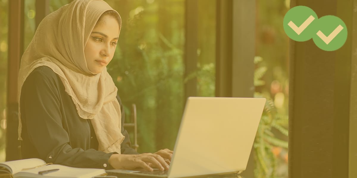 woman taking an ACT practice test online on her computer