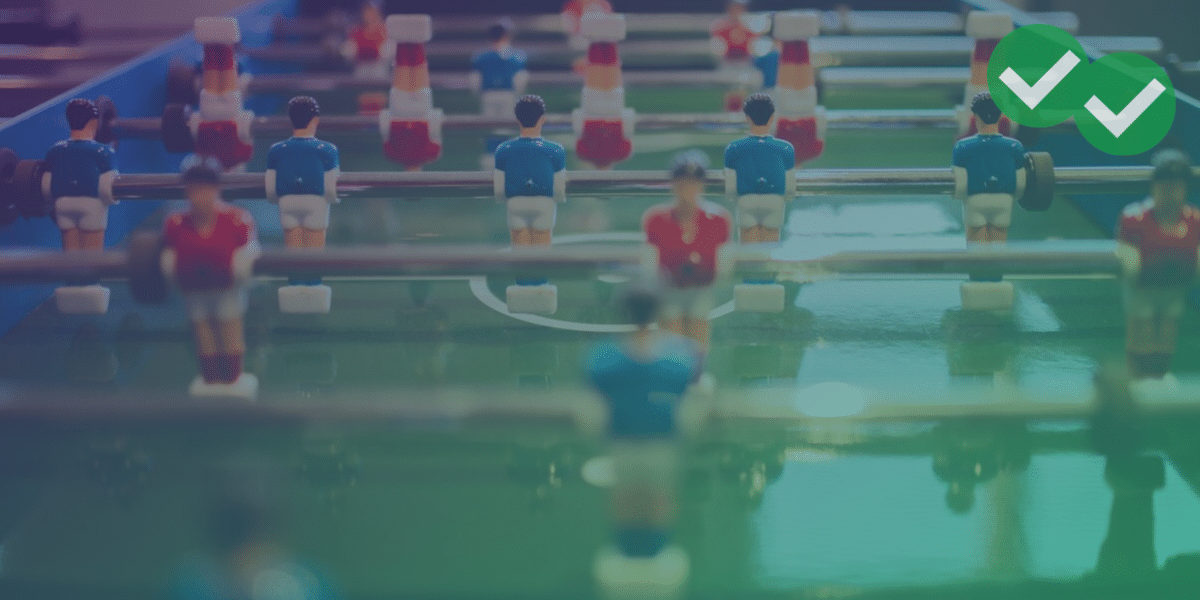 Closeup of foosball table representing competition for good GMAT scores