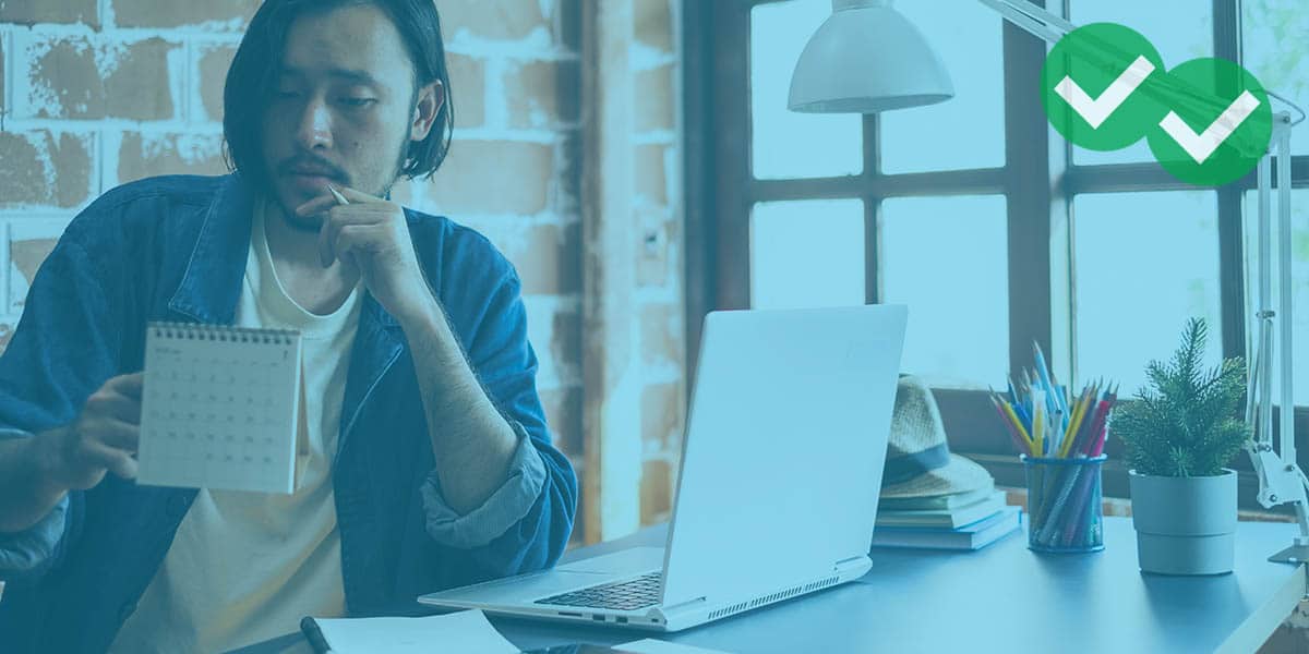 Student looking at calendar representing GMAT study plan 1 month