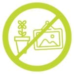 a simple icon the no symbol overlaying a plant and framed landscape picture to indicate no personal items for the gre online -image by magoosh