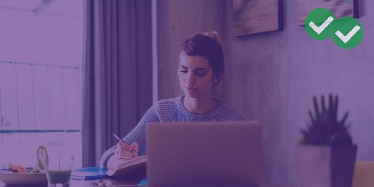 Woman at desk taking a free GRE practice test