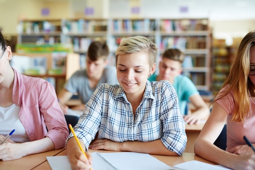 students taking down notes