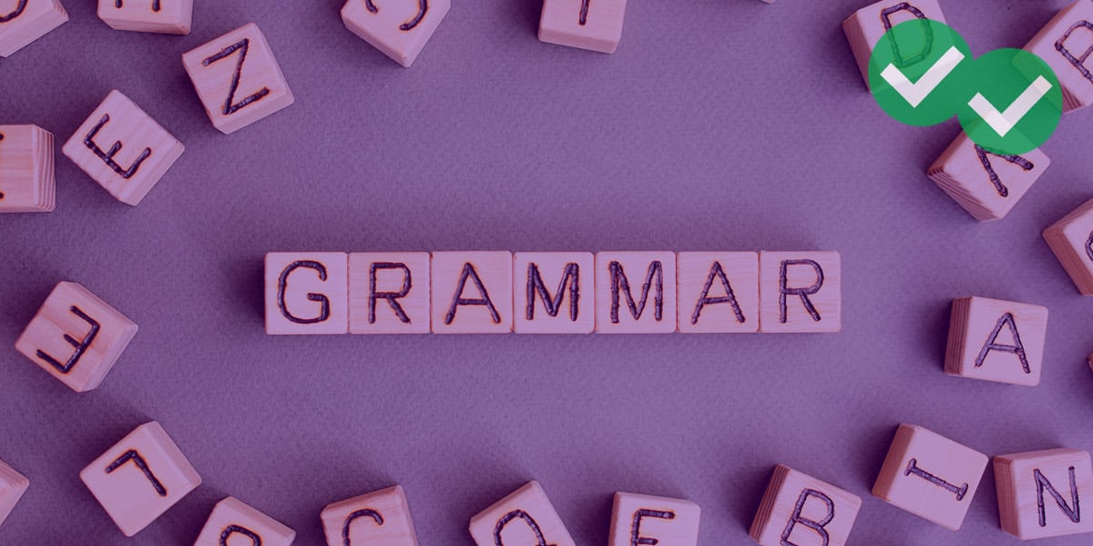 Scattered wooden blocks with letters on them, spelling out grammar to represent SAT Grammar - image by Magoosh