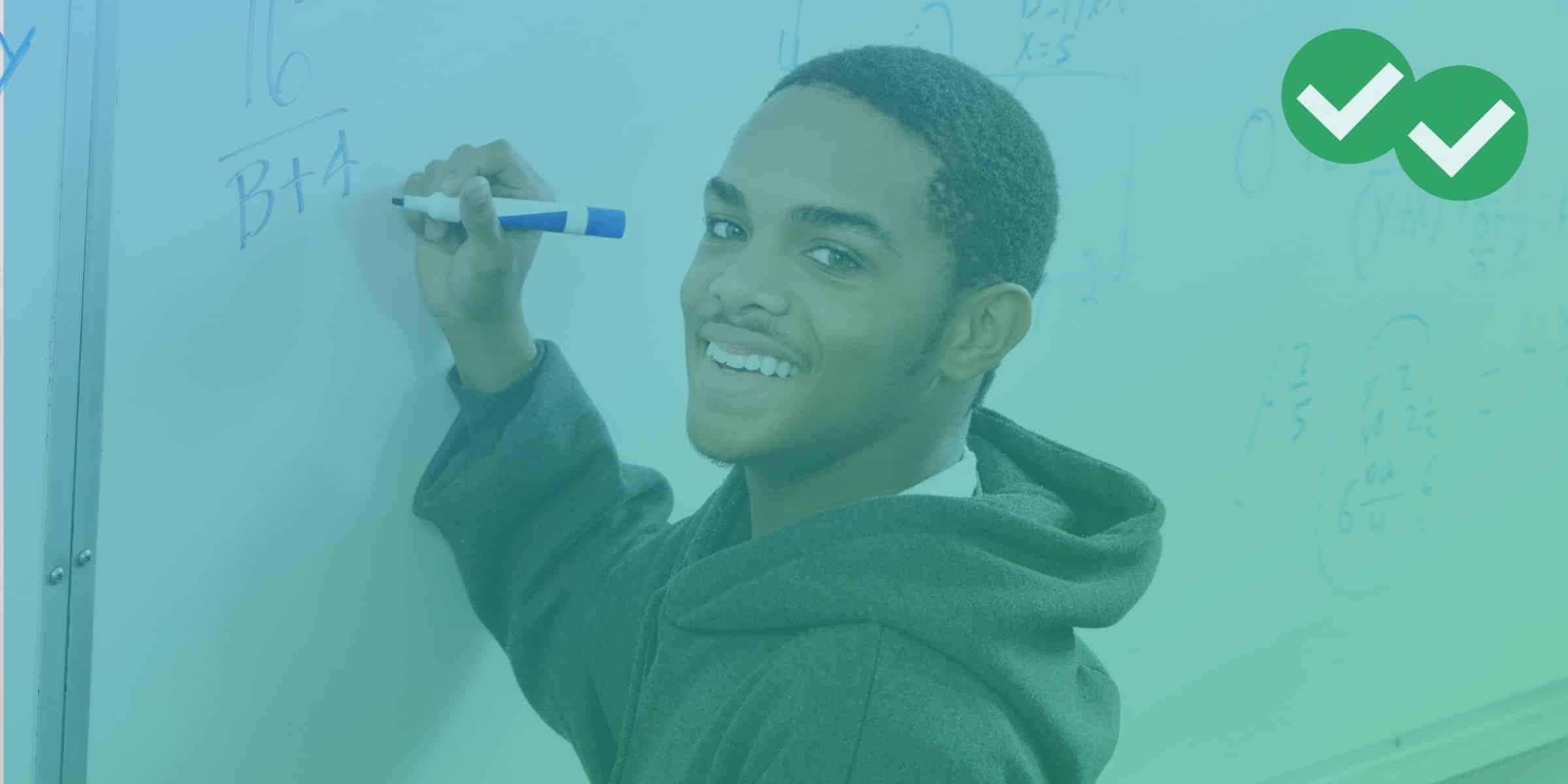 student writing complex math problem on whiteboard while smiling at camera