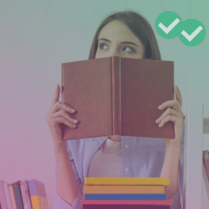Student looking up from pile of books