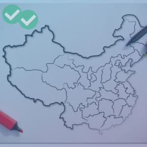 Pen and highlighters over blank IELTS writing map - image by Magoosh