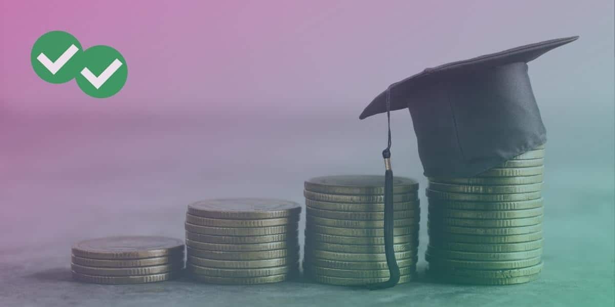Stacks of coins with a graduate hat on top of the last pile