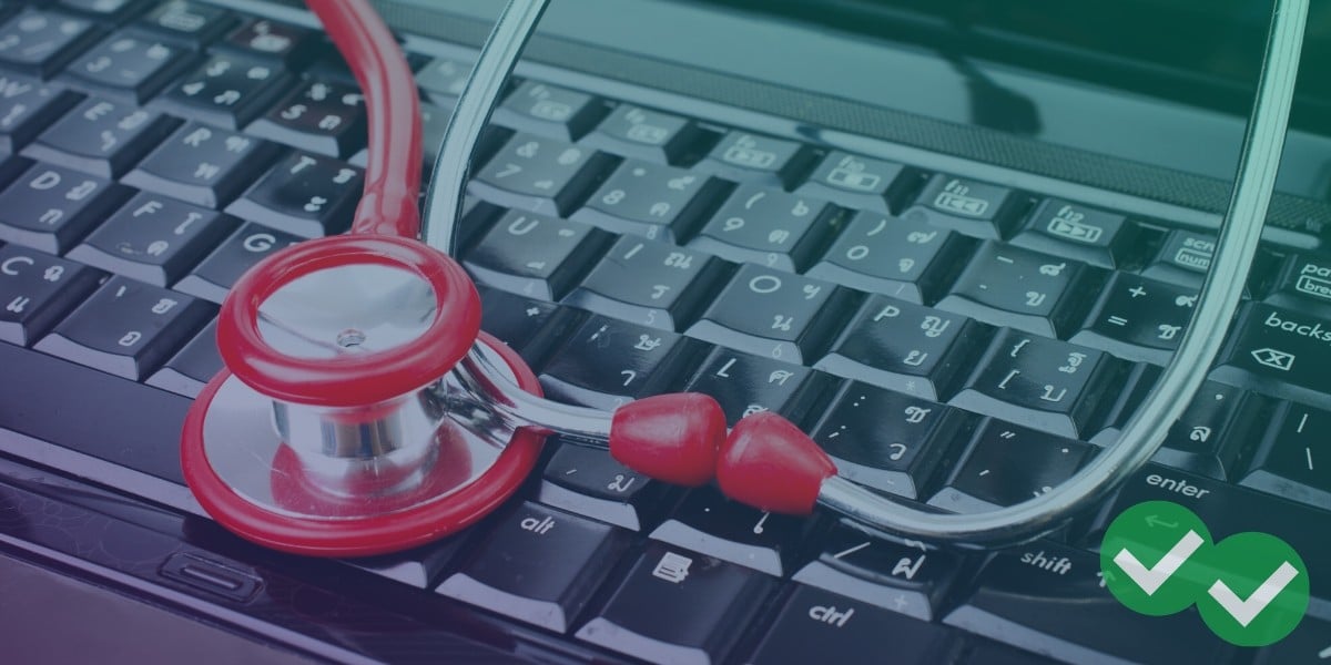 Red stethoscope on top of black keyboard representing shortened MCAT experience - Image by magoosh