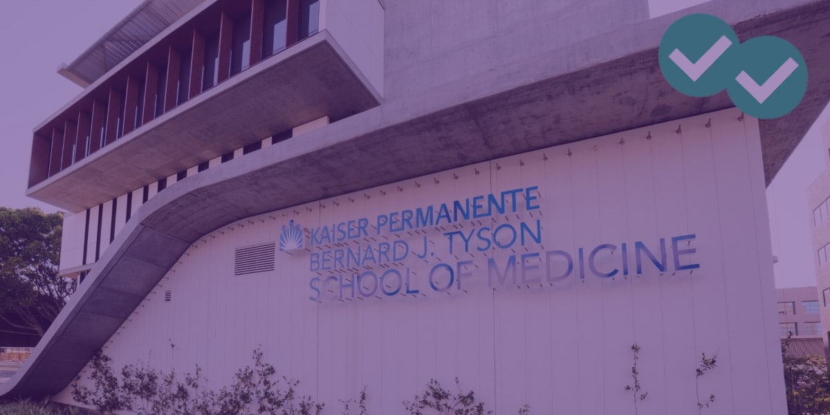 Side view of building with sign that says Kaiser Permanente Bernard J. Tyson School of Medicine, representing Free Medical School - image by Magoosh