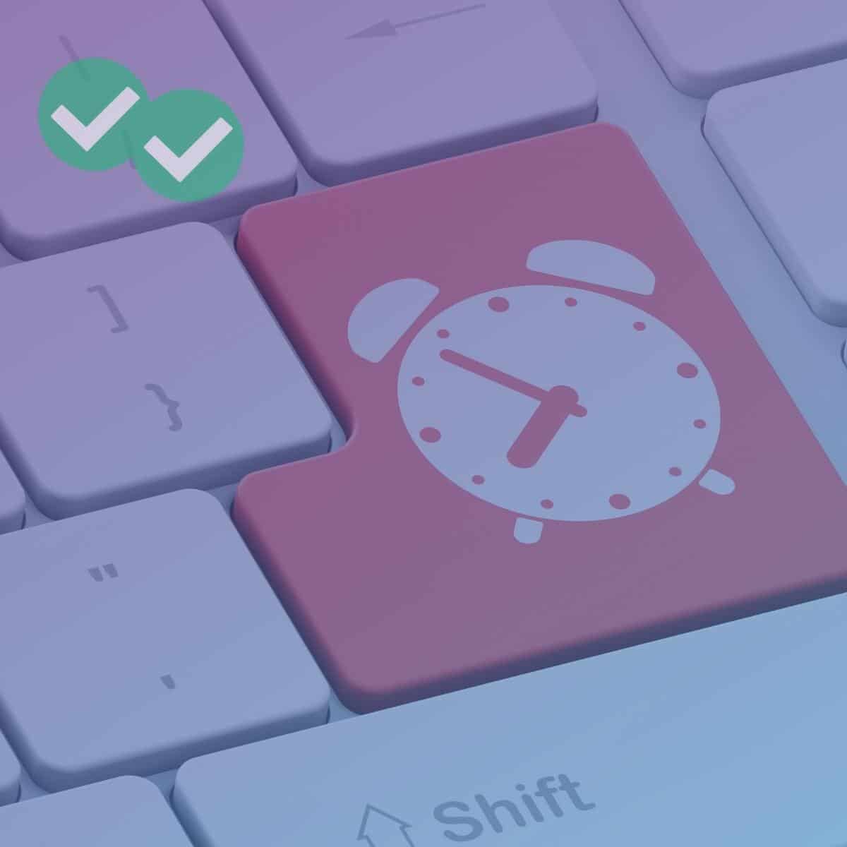 Enter button on a keyboard with an alarm clock