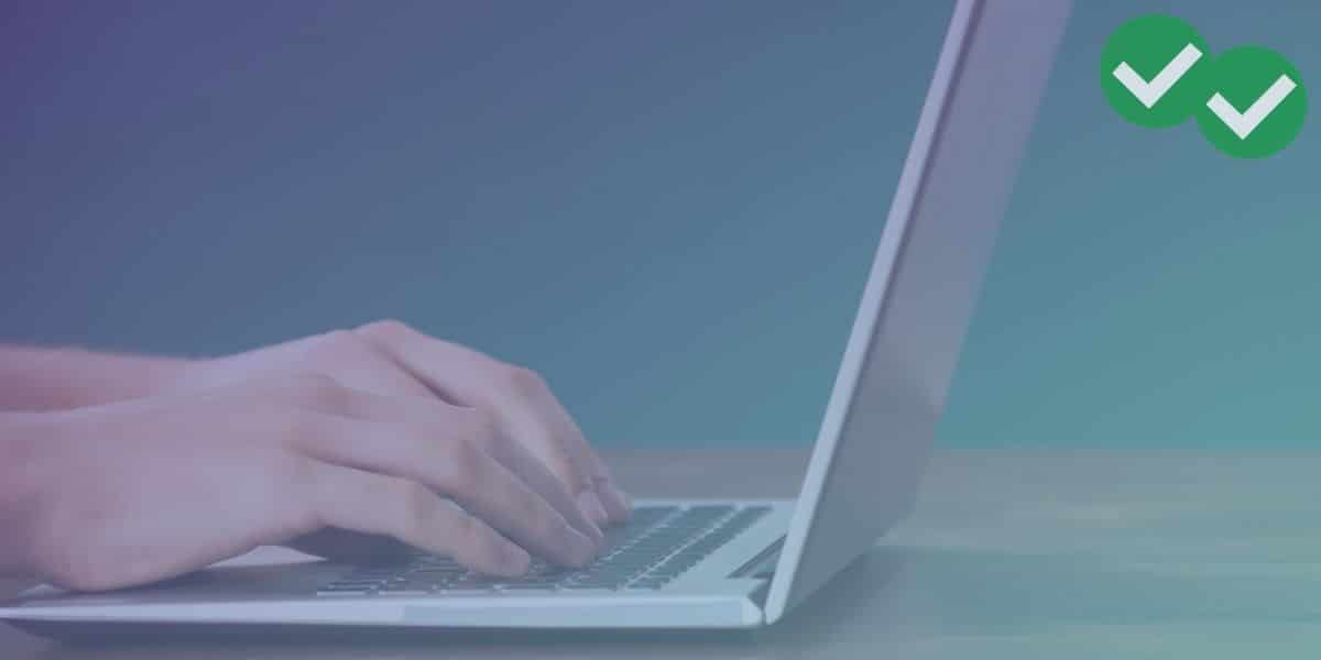 Header image for the blog post "I Took the TOEFL Home Edition." Shows hands typing on a laptop computer.