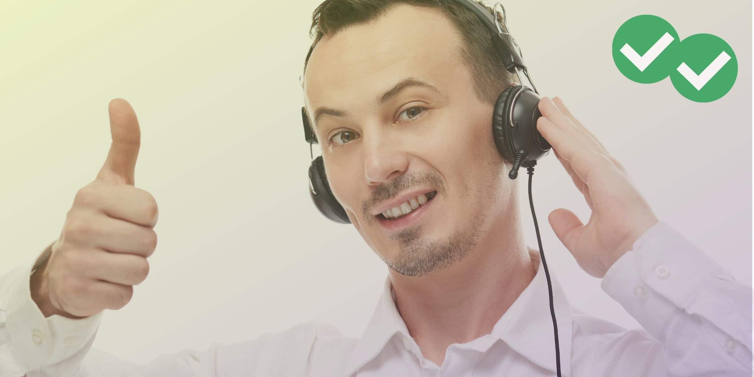 Man wearing headset smiling and holding a thumbs up, representing TOEFL speaking topics - image by Magoosh